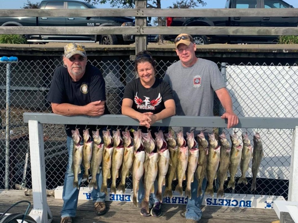 Three anglers with two fish caught in Erie