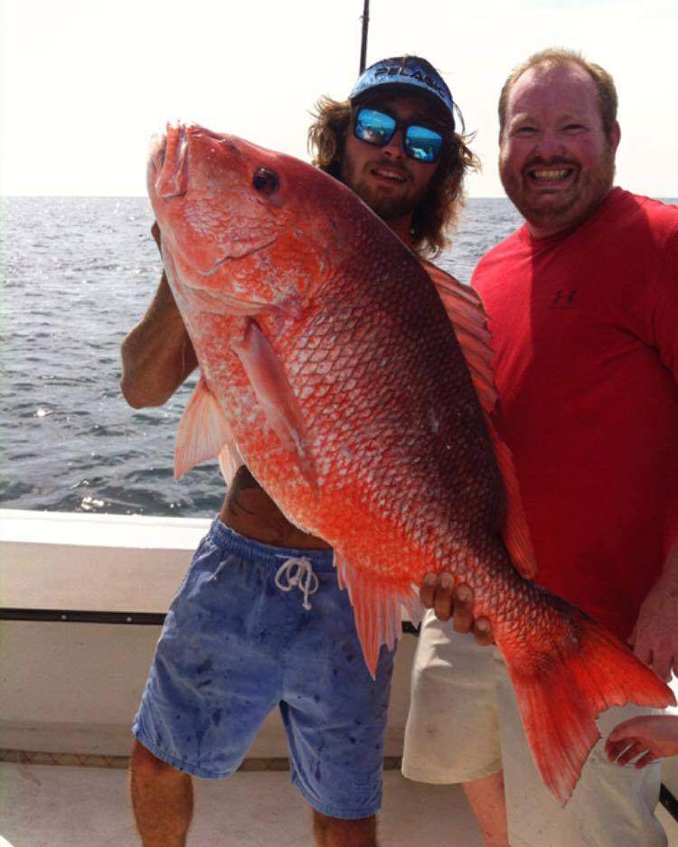 Two anglers with a big 29-inch fish caught in AL