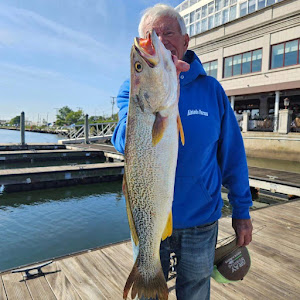Fisherman with a big 32-inch catch in Howard Beach
