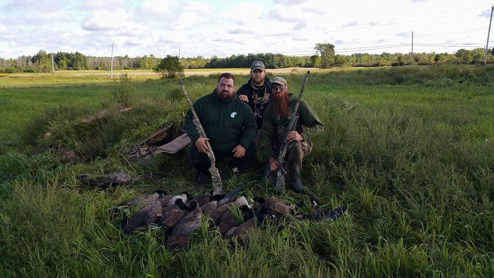 Three people enjoying a fishing and hunting trip in NY