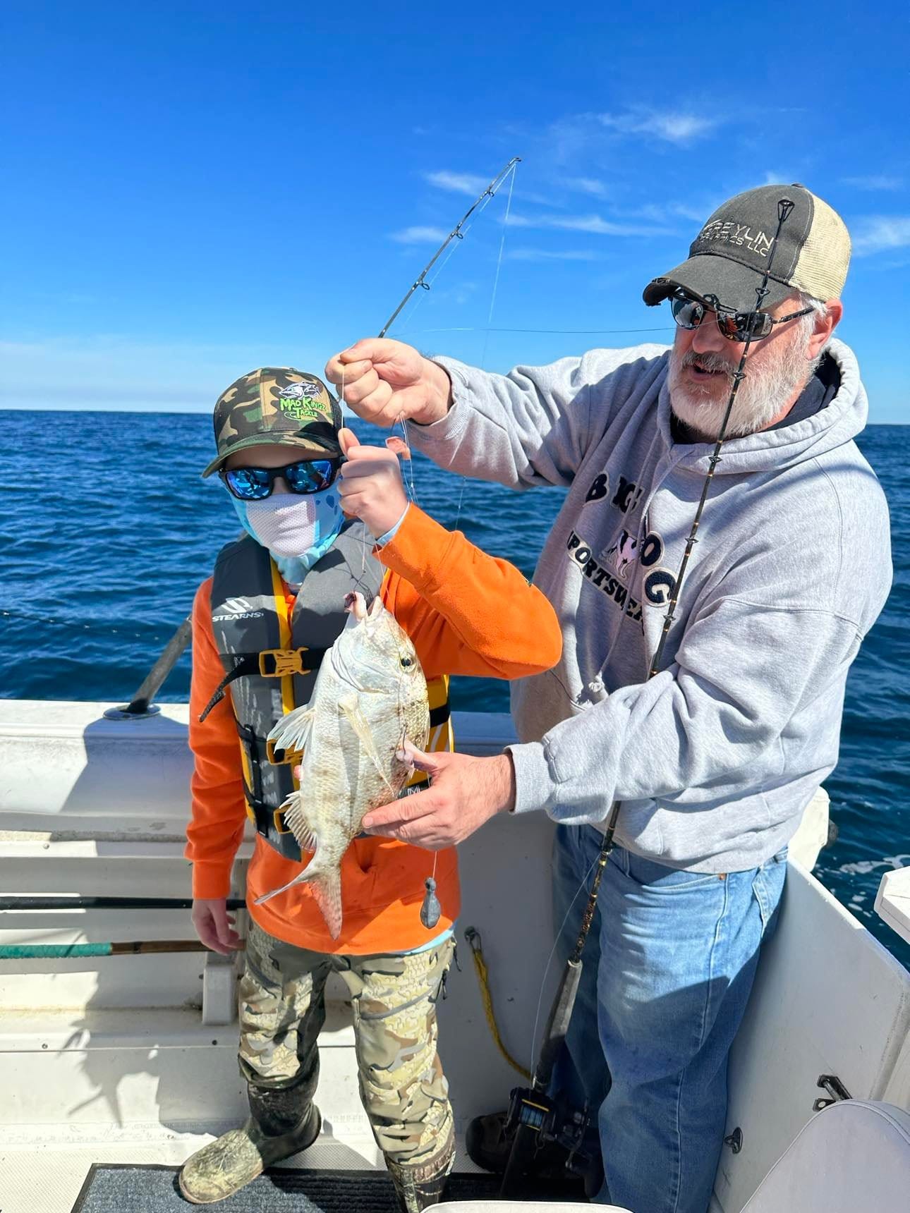 A breathtaking view of the Oak Island coastline with two anglers fishing
