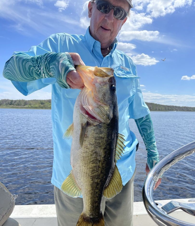 Large bass fish being held on boat in Winter Haven FL waters