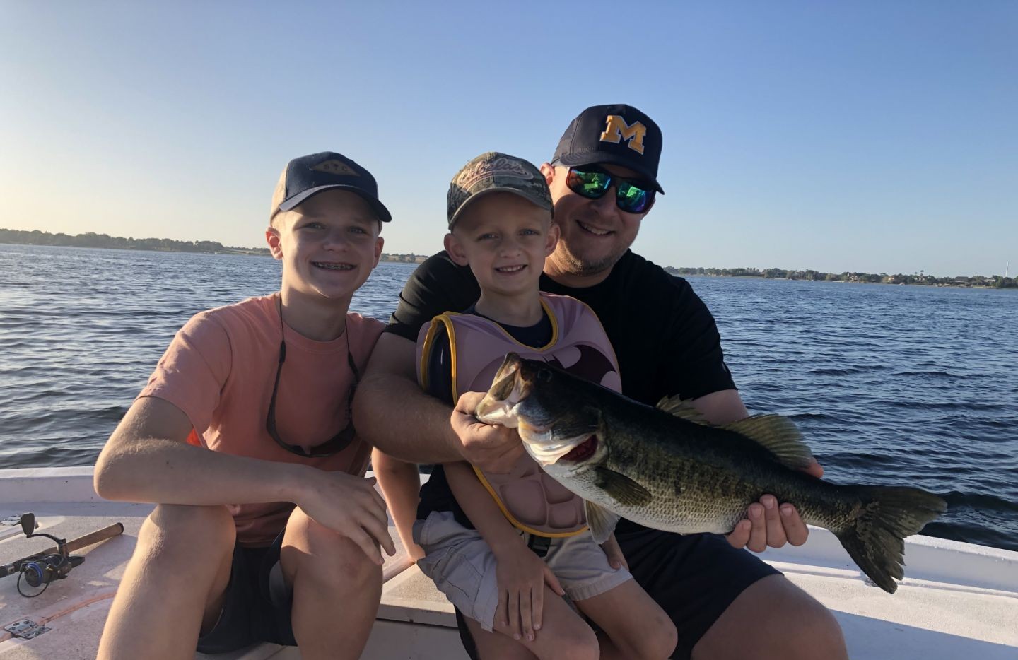 Bass fishing success on Winter Haven FL lake with freshly caught largemouth bass