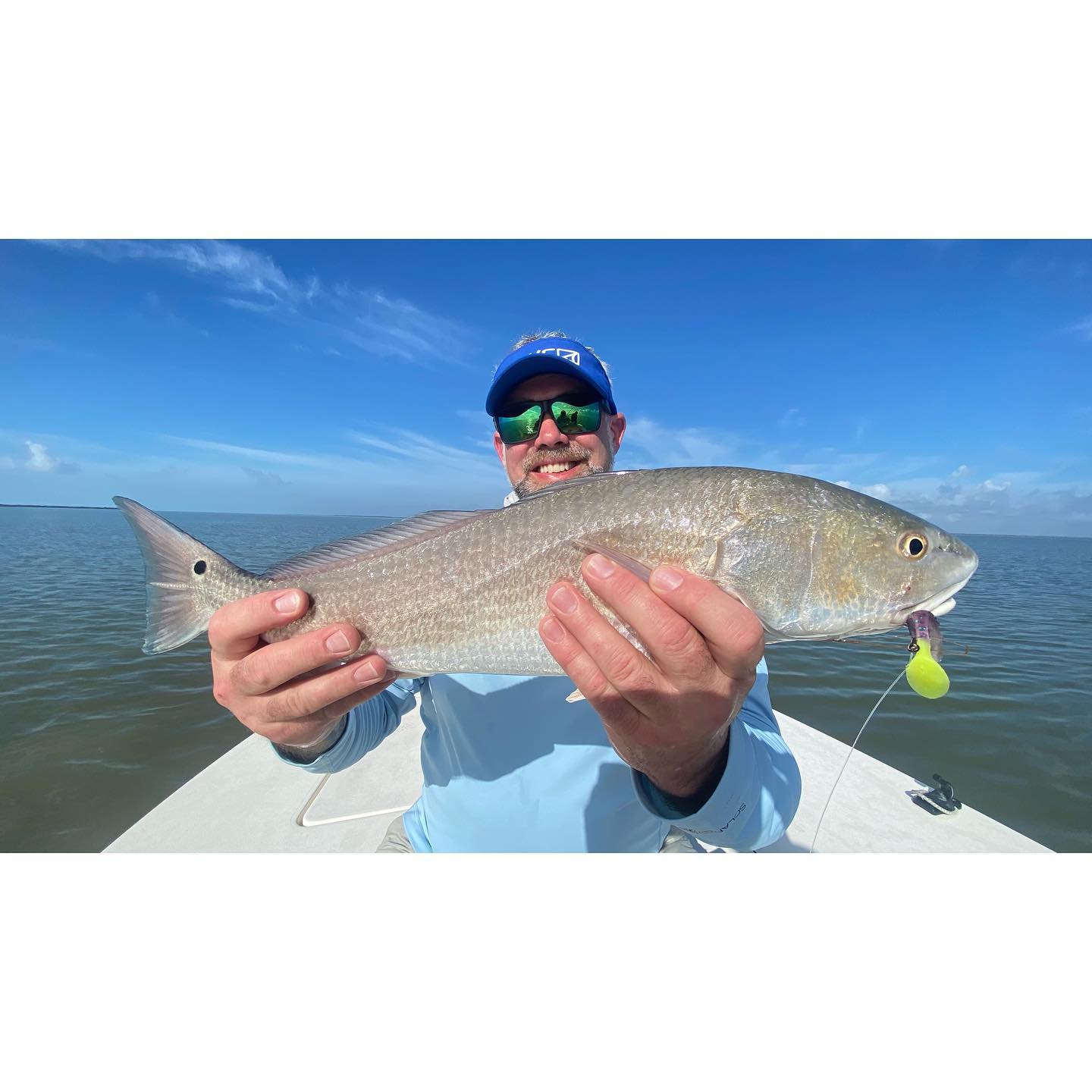 A lone fisherman reeling in a catch in Florida
