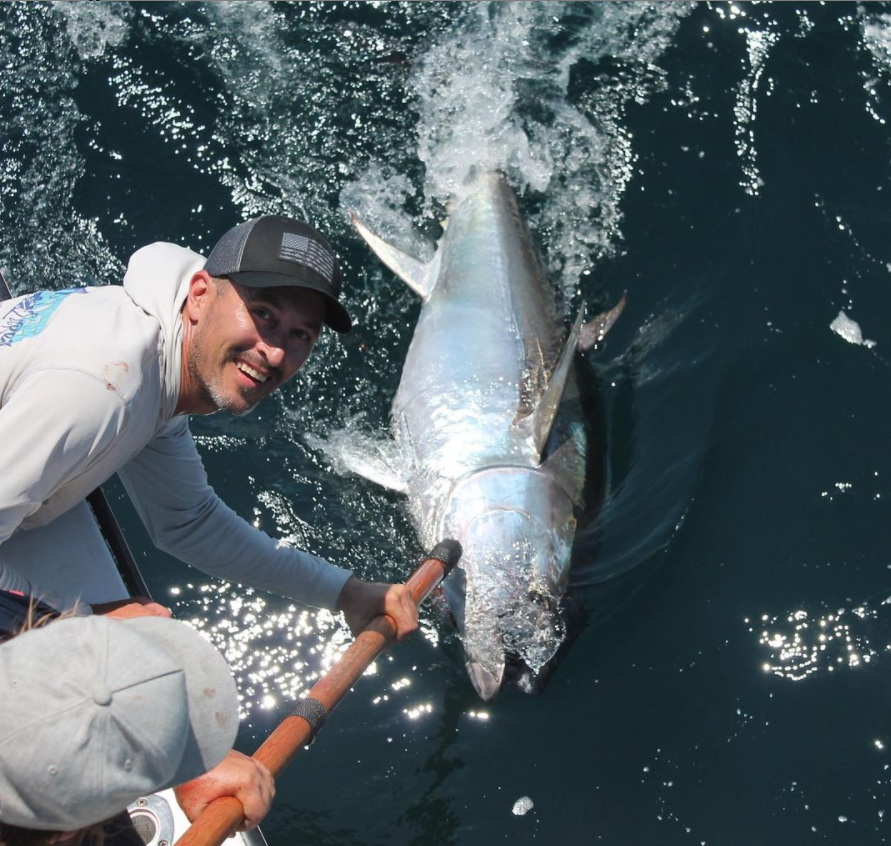 Fisherman catching a 17-inch fish in NY