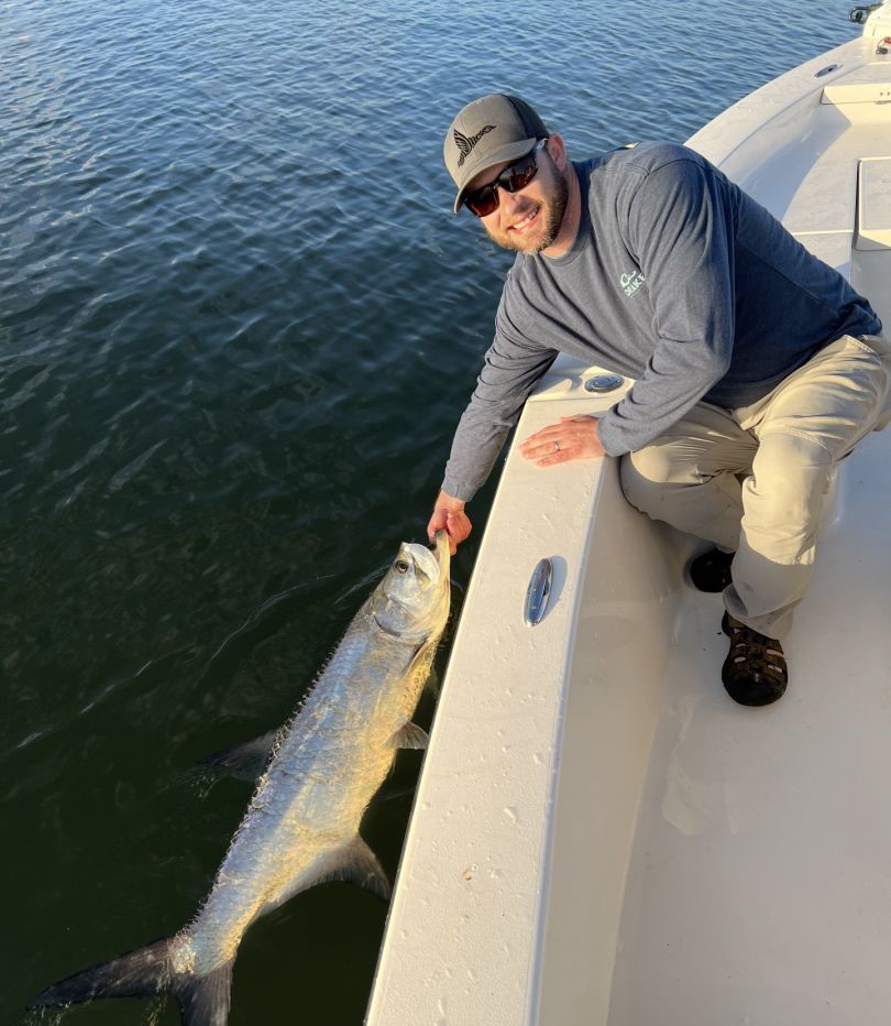 A fisherman with a large tarpon catch in Melbourne