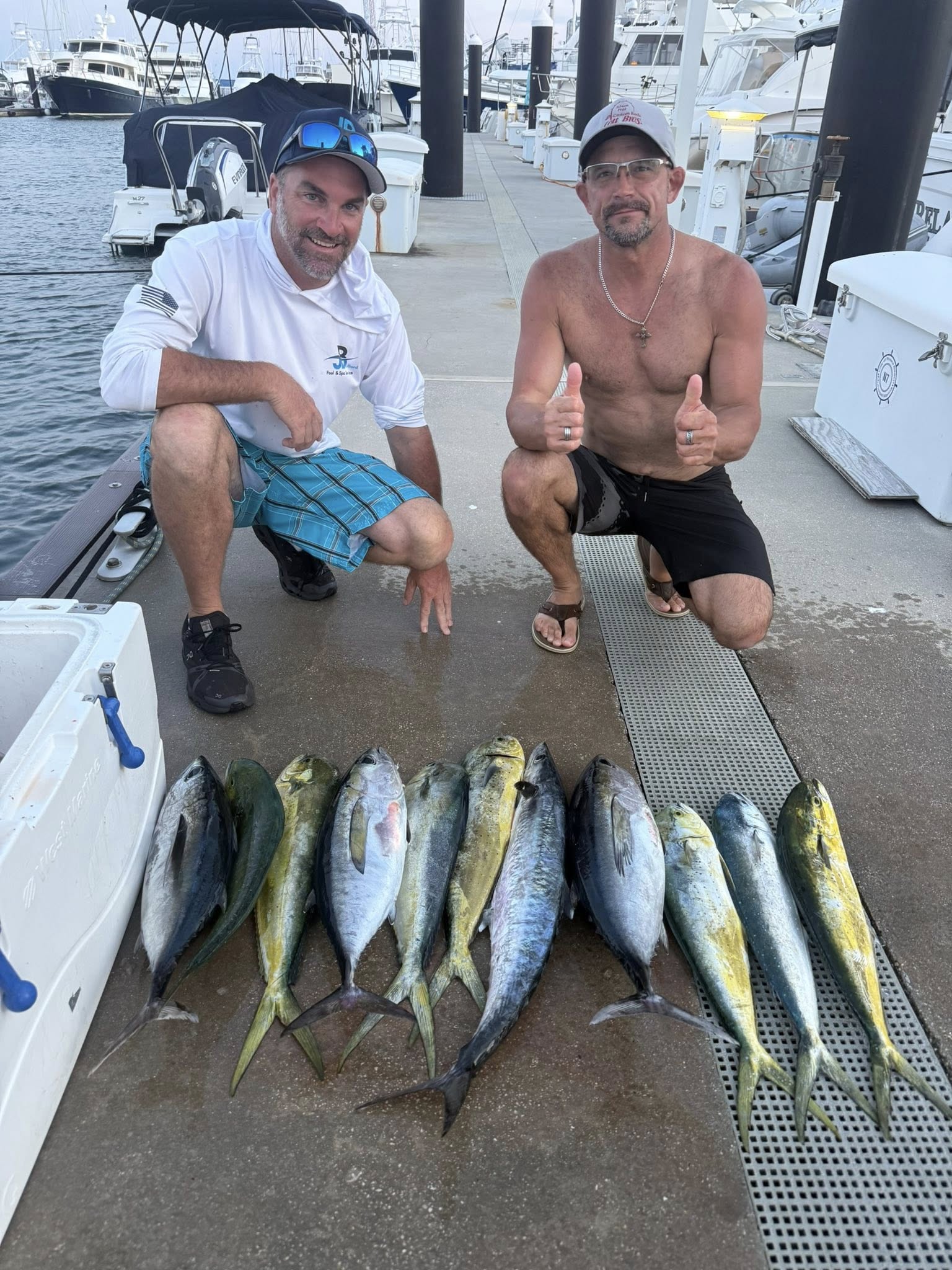 Fresh catch of mahi mahi, king mackerel, and blackfin tuna displayed on dock in Riviera Beach FL
