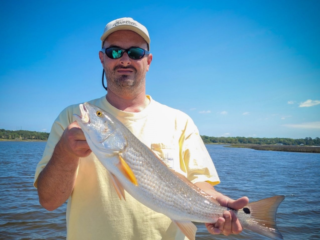 Angler holding a 20-inch fish in FL