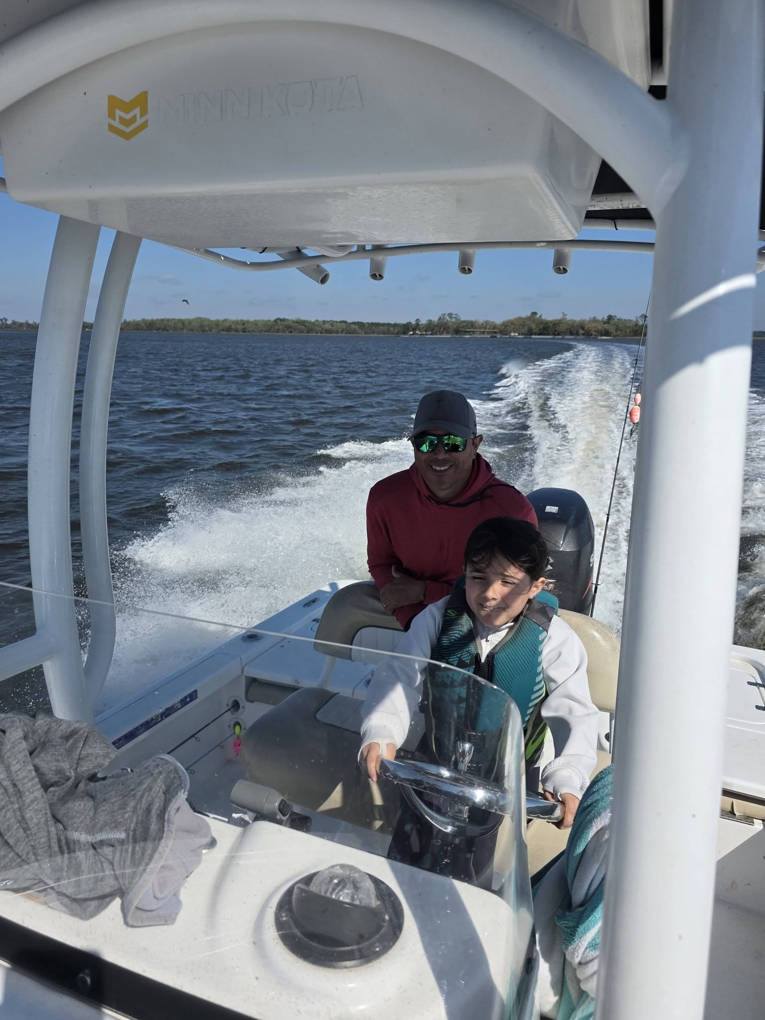 Fishing boat traveling through waters near Brunswick GA with wake trailing behind
