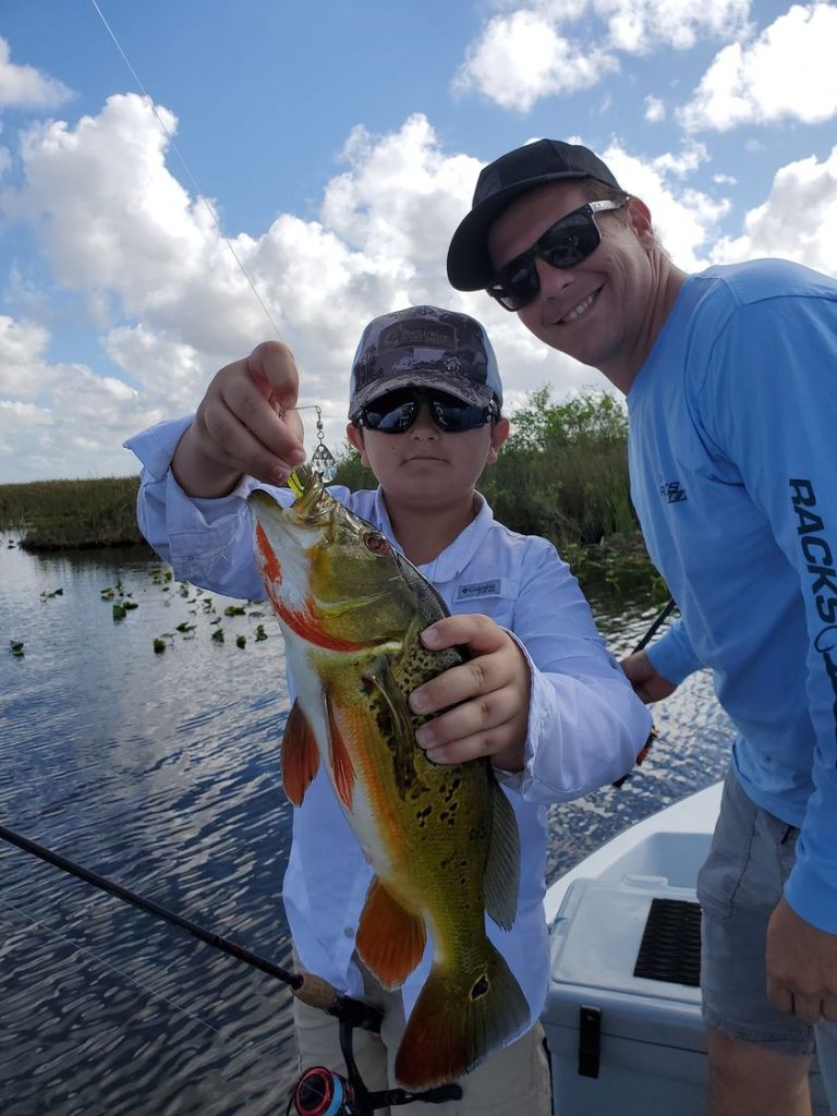 Two anglers fishing in Florida with a big 22-inch fish