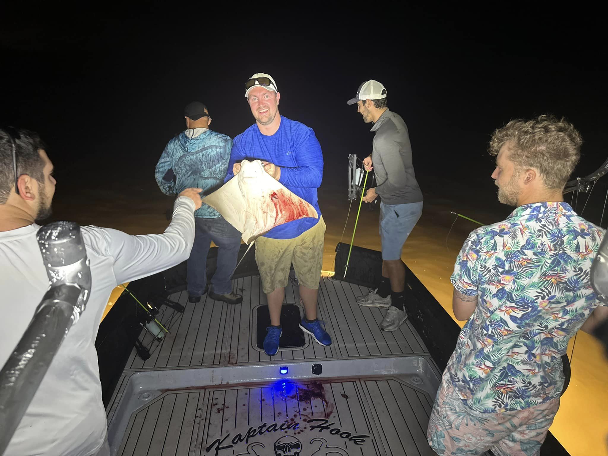 Four people enjoying a fishing trip in FL