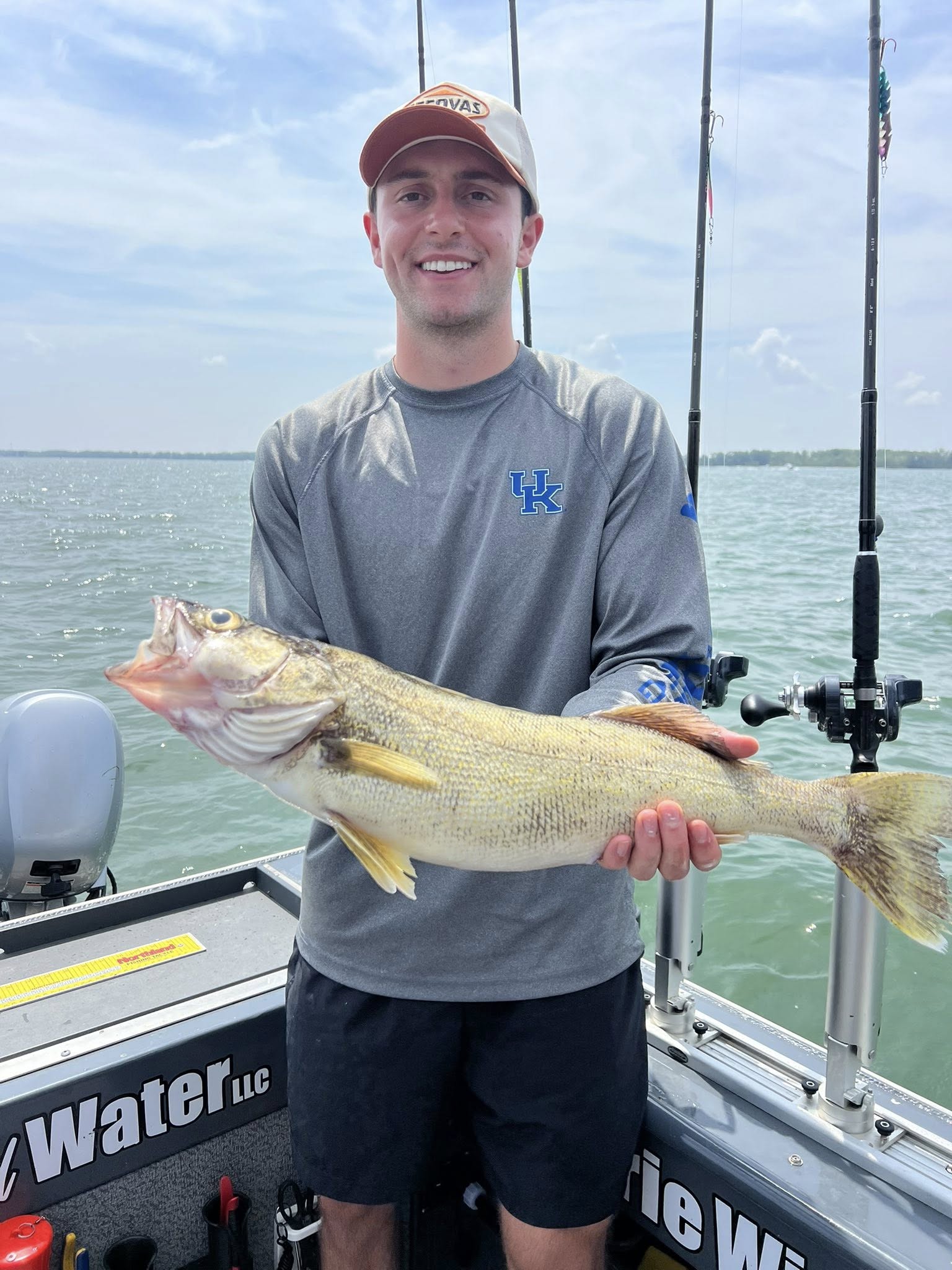 Angler casting fishing line at lakeside in Marblehead
