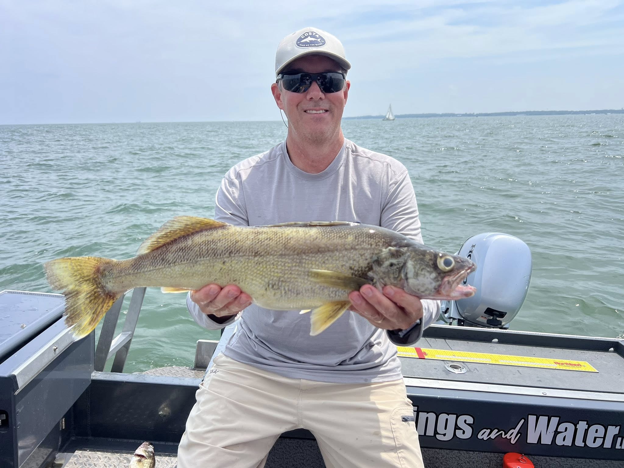 Person fishing at lakeside in Marblehead