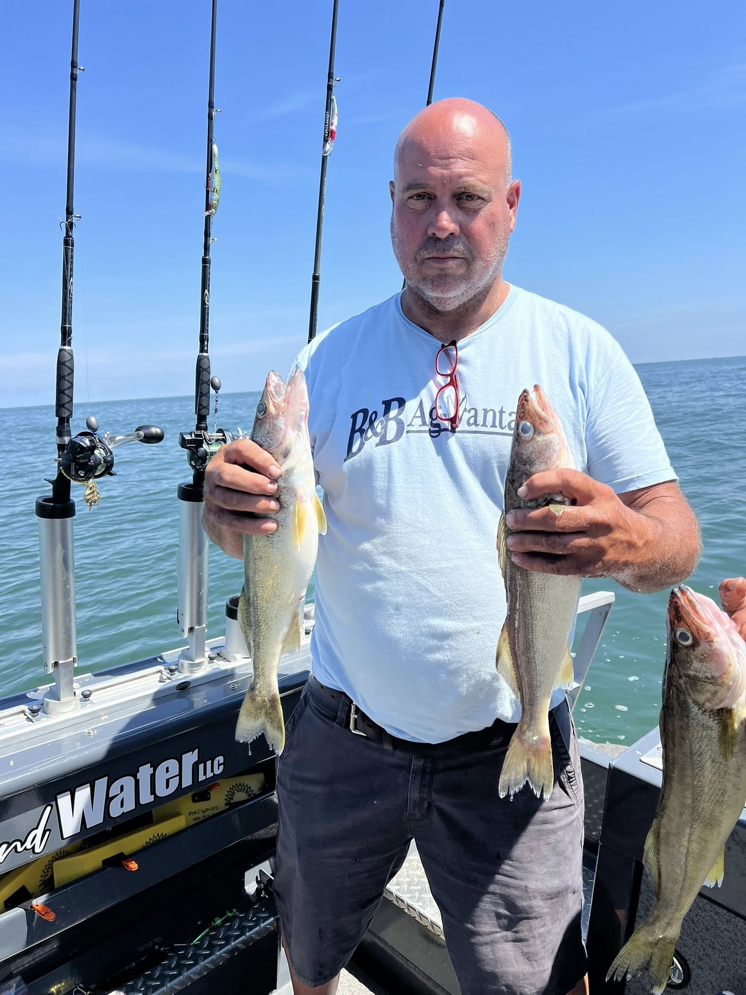 Three anglers fishing in OH, showing off their catch