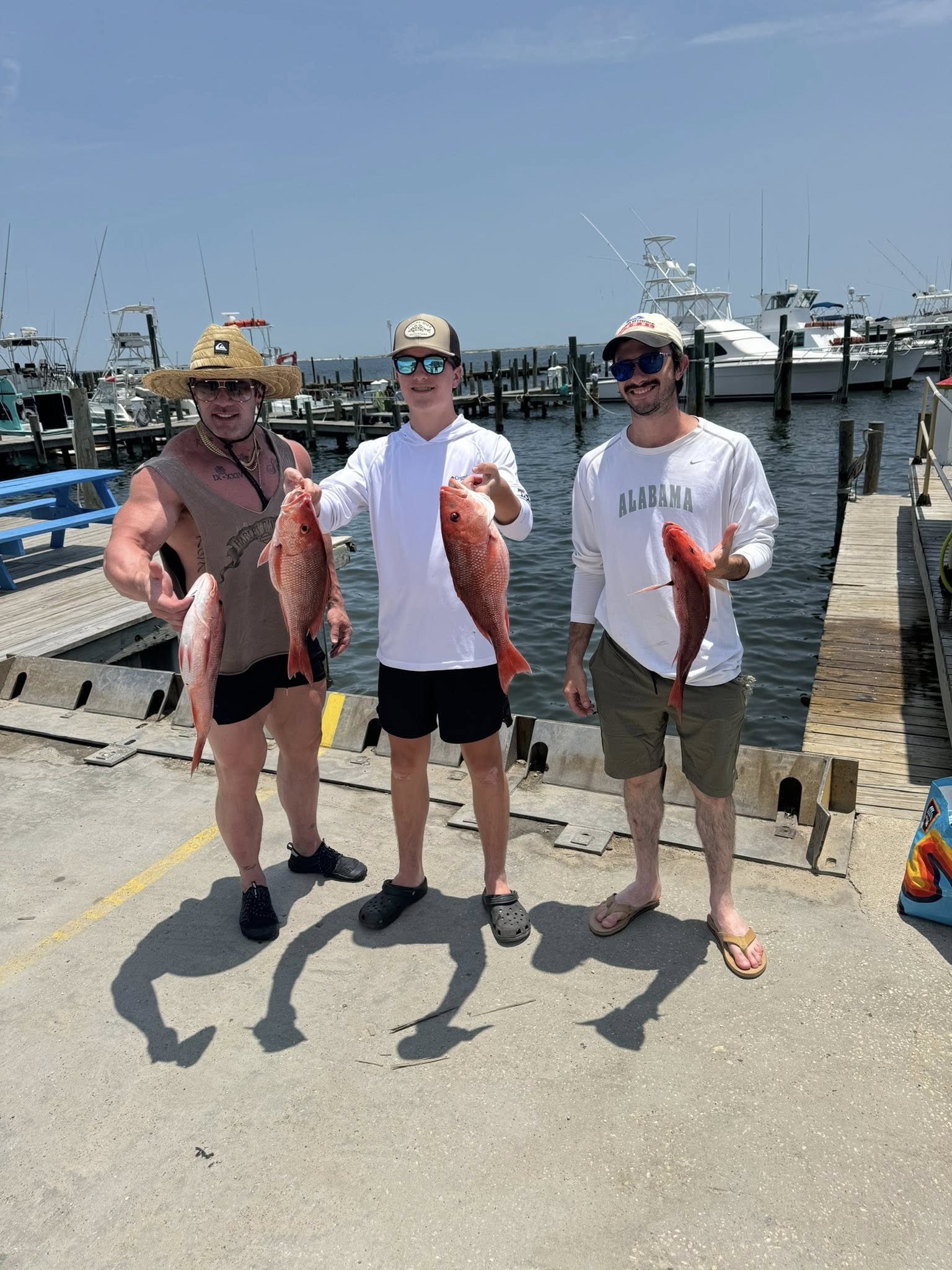 3 people fishing with 2 fish caught in FL