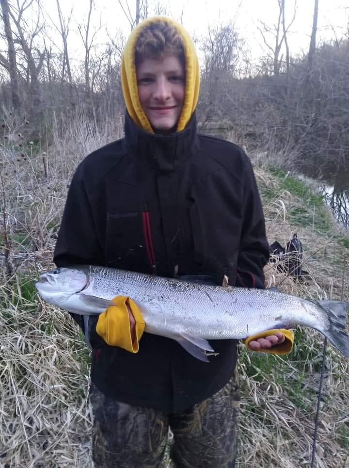 Angler holding a 24-inch fish in WI