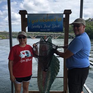Two people enjoying a fishing trip in Branson