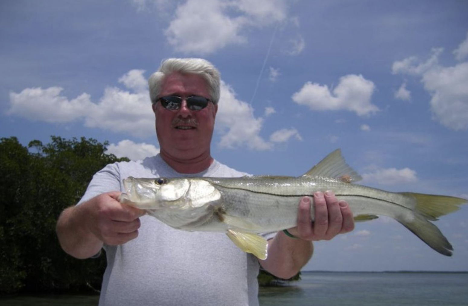 Angler holds a 25-inch fish in FL