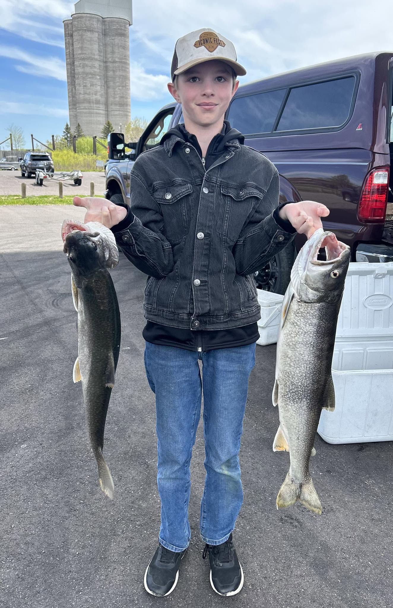 Two lake trout caught fishing in Duluth Minnesota displayed at boat launch