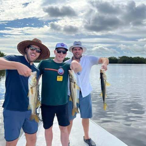 Three anglers with fishing rods in Ruskin