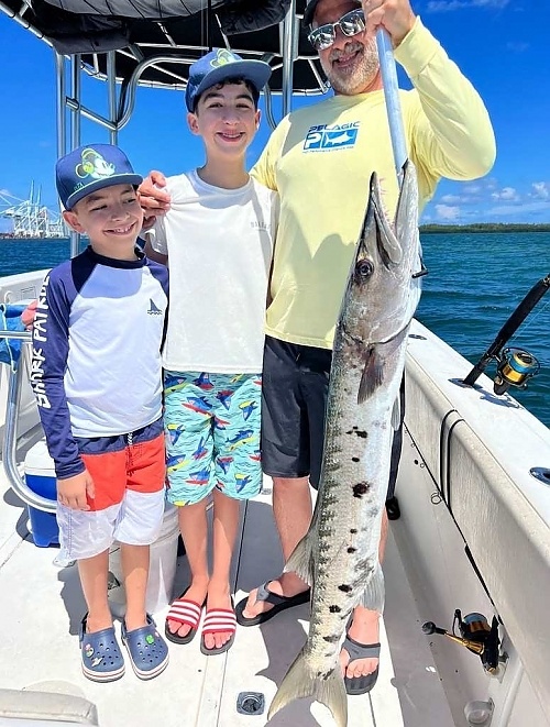 Angler with a great barracuda fish in Miami