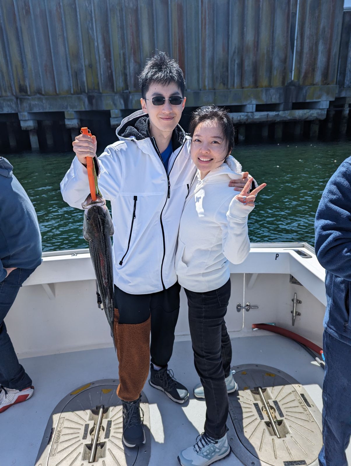 Two anglers enjoying a great fishing trip in Gloucester