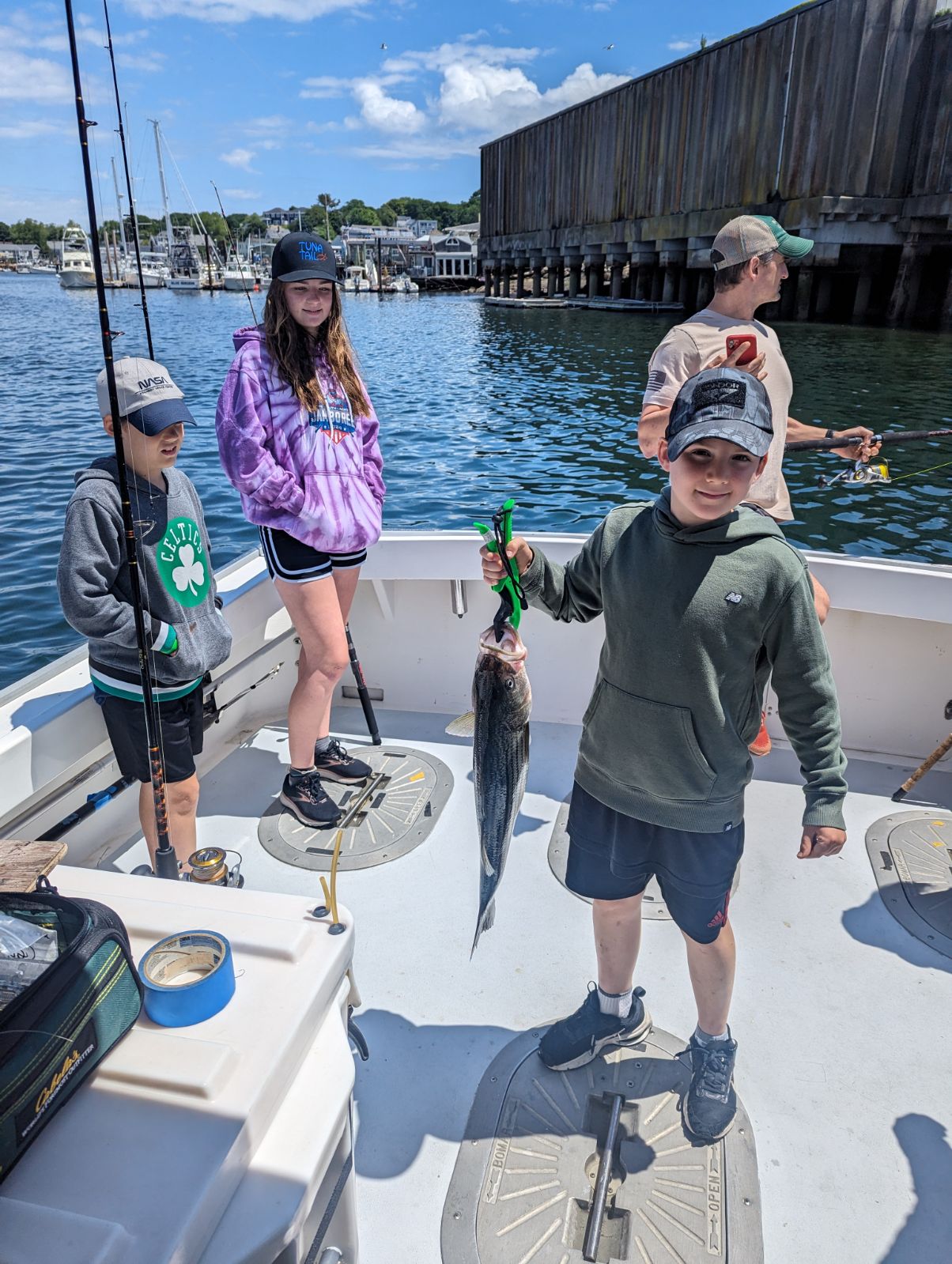 4 people fishing in MA