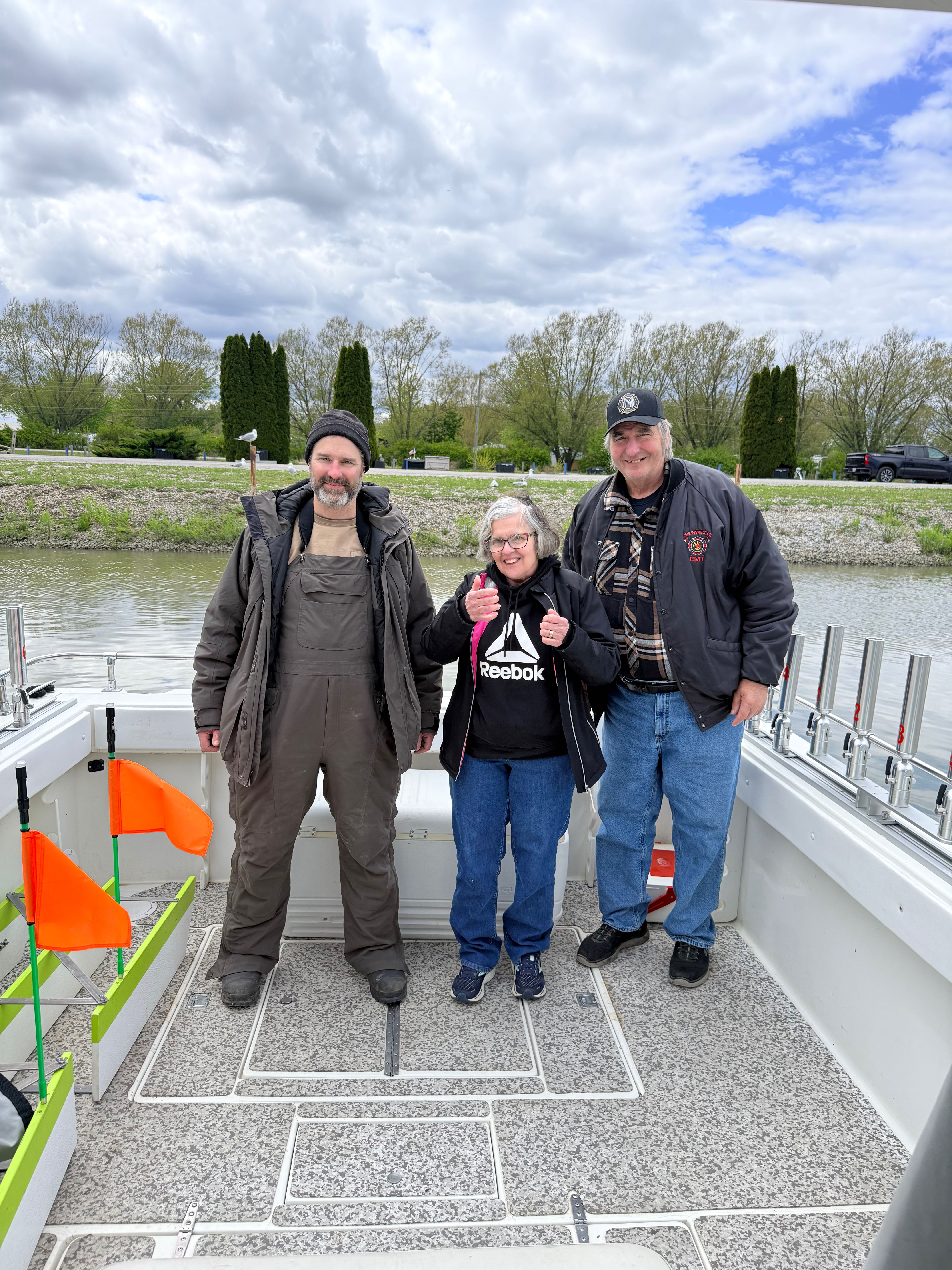 Fishing boat docked at marina in Oak Harbor OH with anglers ready for departure