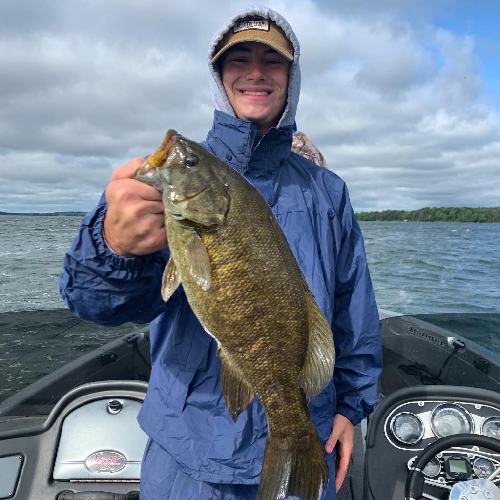 A person fishing in Minnesota with a 22-inch fish