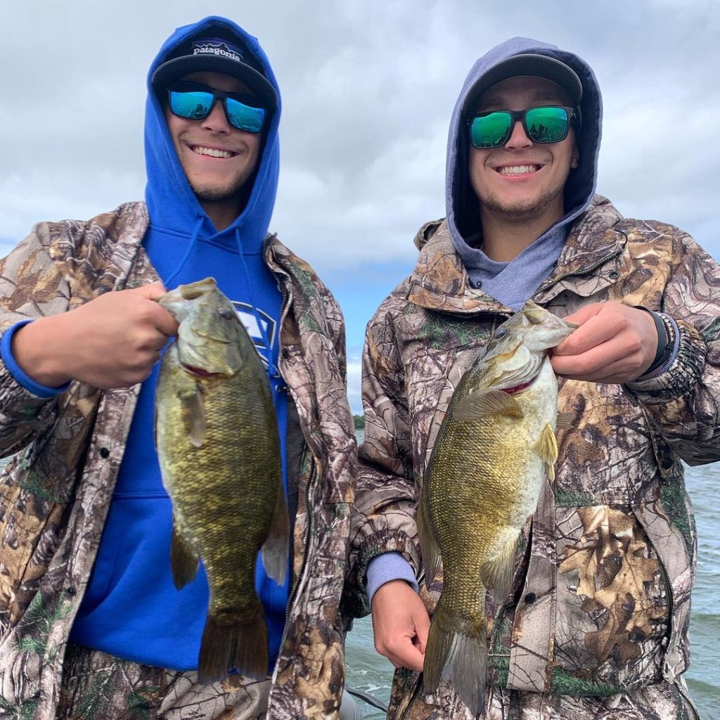 Two anglers fishing at Mille Lacs lake with 2 catch of 18-inch fish