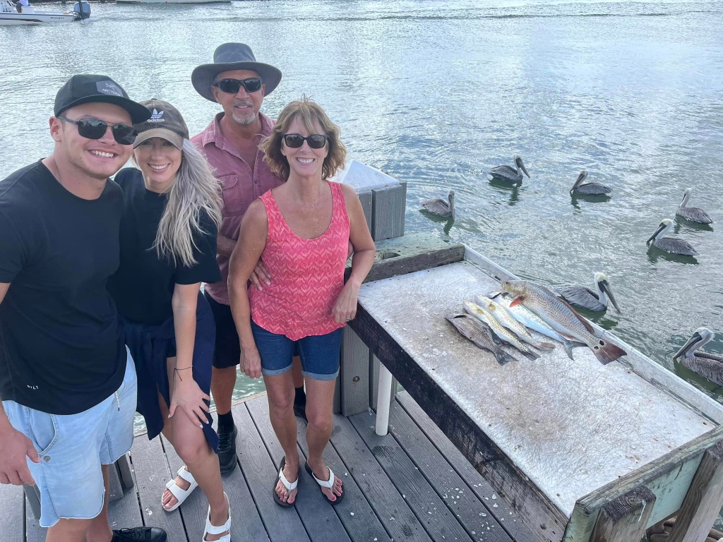 Four people enjoying fishing trip in Florida