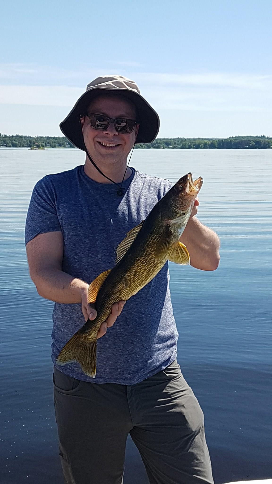 One angler holds a fishing rod near the town of Renfrew