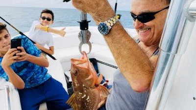 Three people enjoying a day of fishing in Sarasota