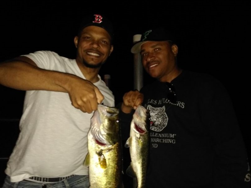 Two anglers with a catch of two fish in Orlando
