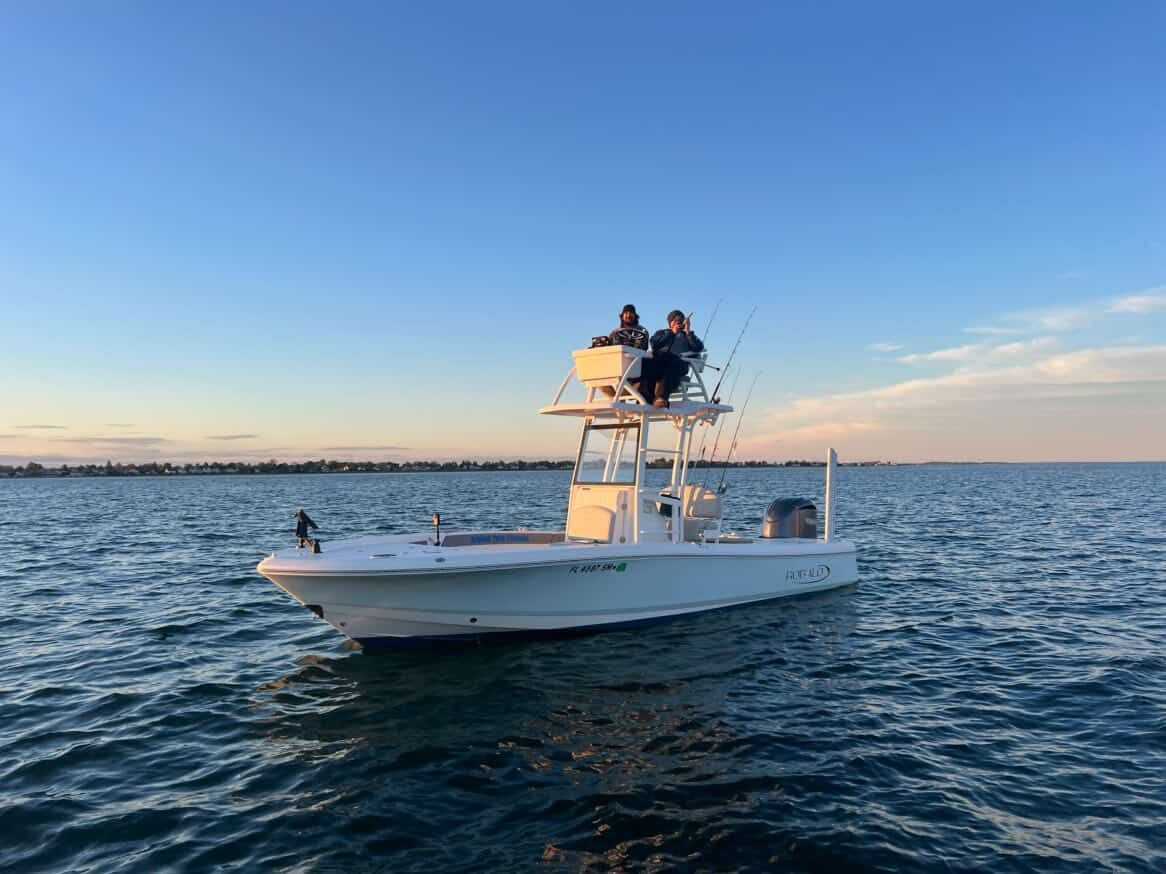 Fishing boat with tower on calm water in Milford CT during golden hour