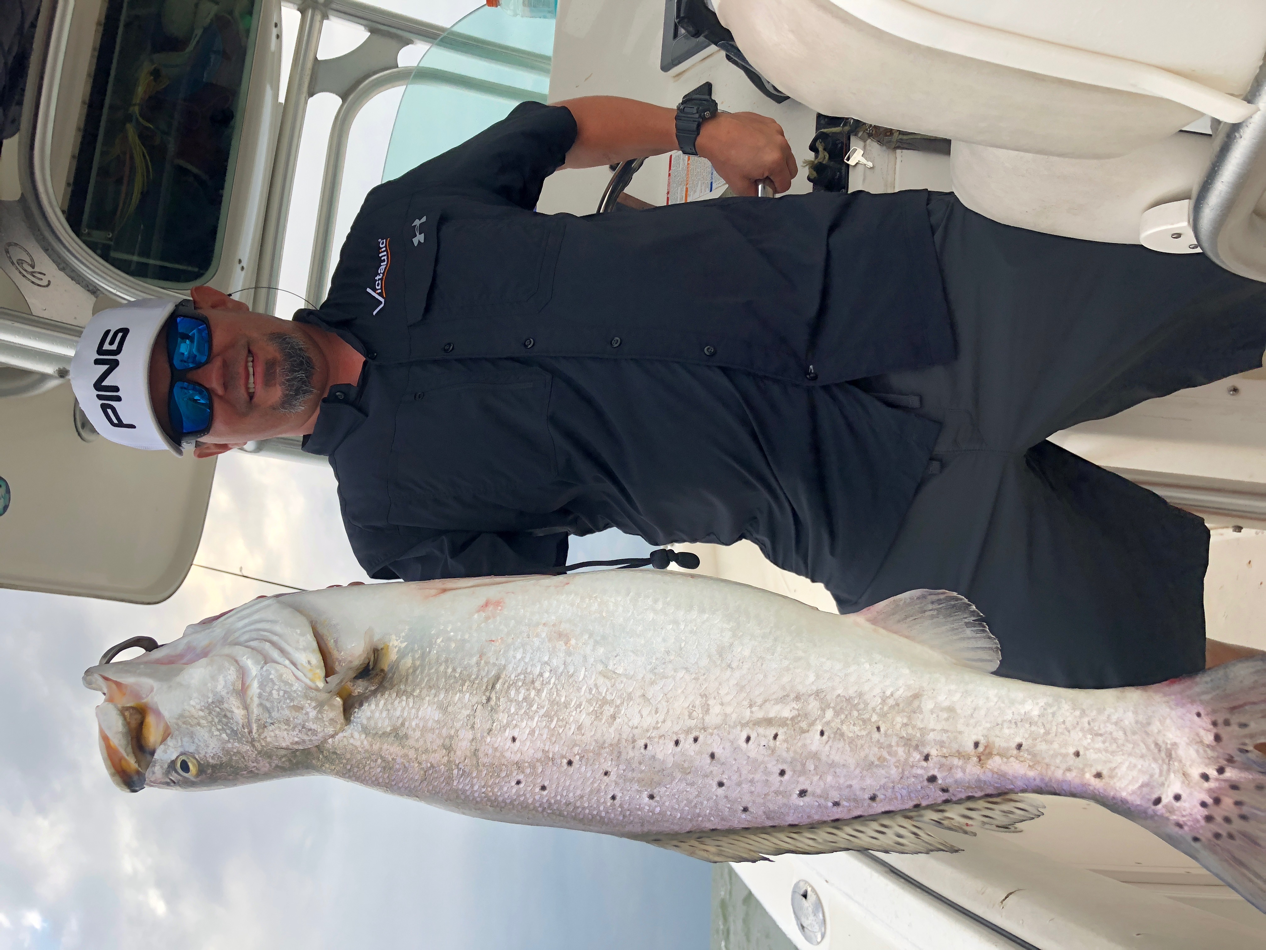 Angler fishing for spotted weakfish in TX