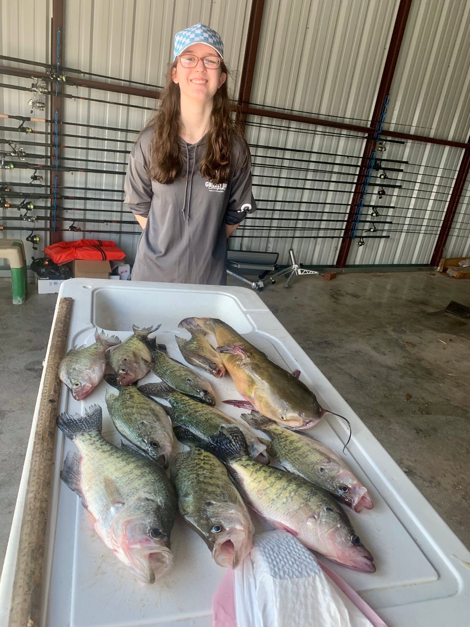 Fresh caught fish displayed in white cooler at Rogers AR fishing location