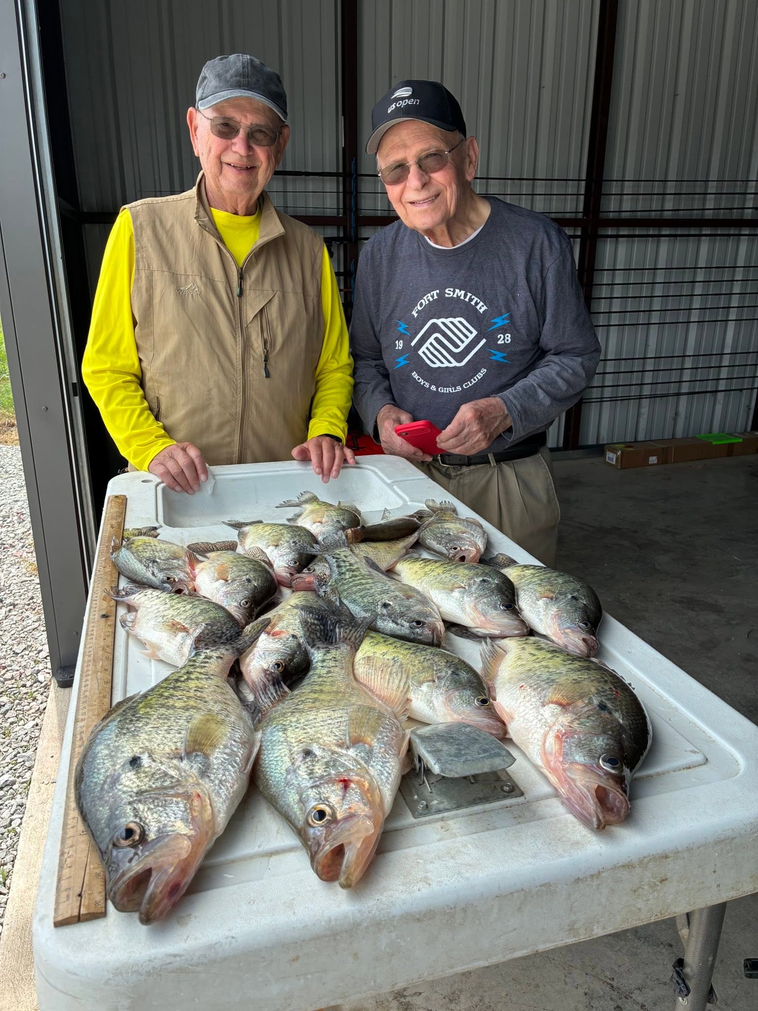 Fresh caught fish displayed on cleaning table at Rogers AR fishing location