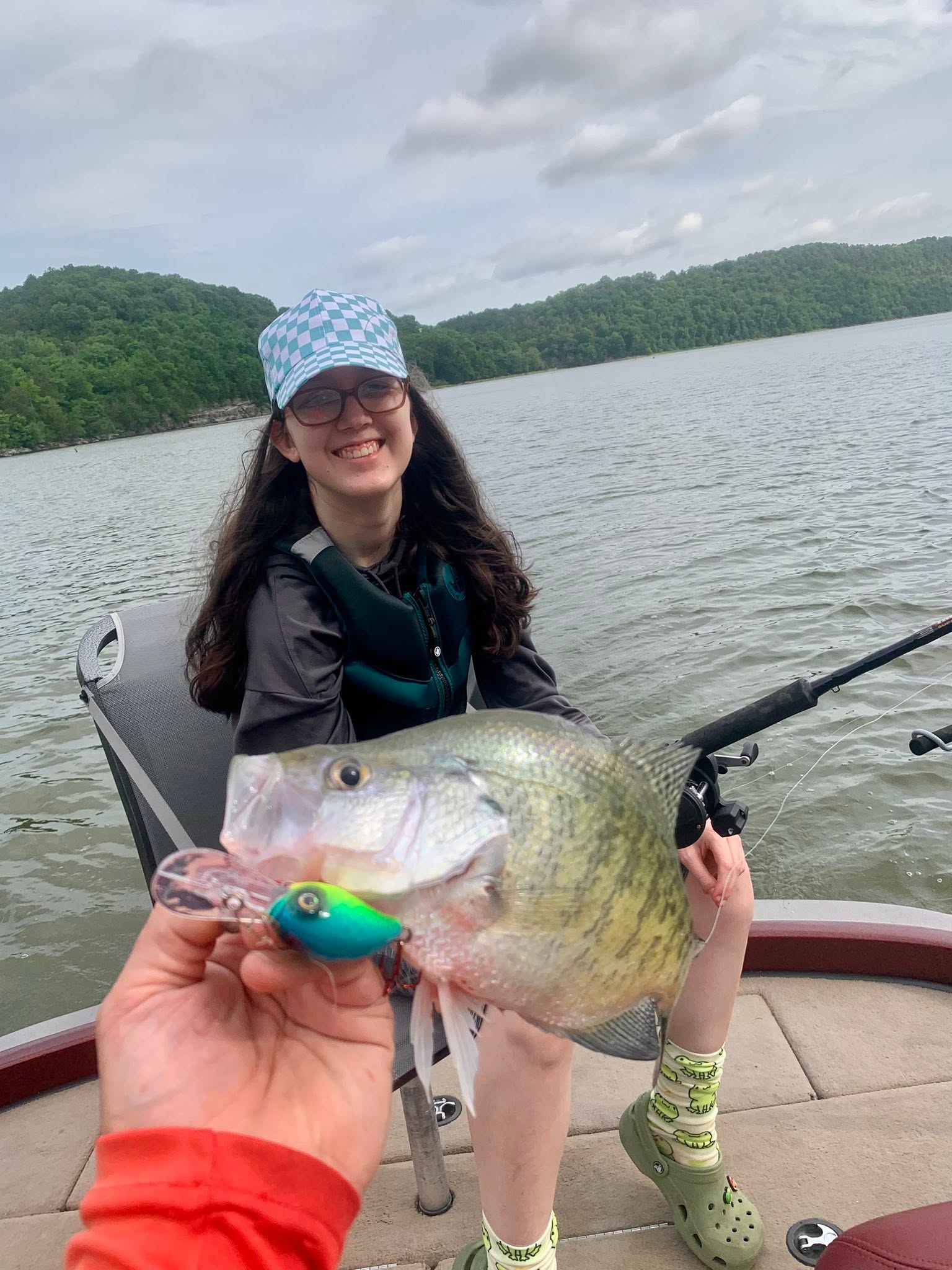 Freshwater fish caught with green lure on boat in Rogers AR lake