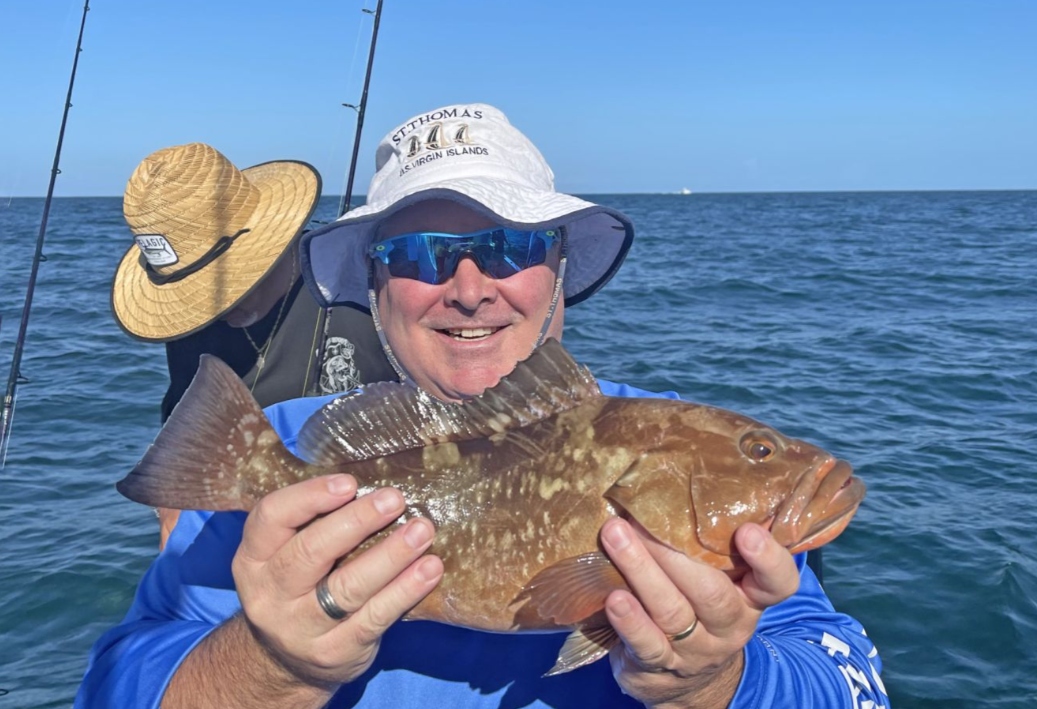 Man fishing with rod at Fort Myers Beach