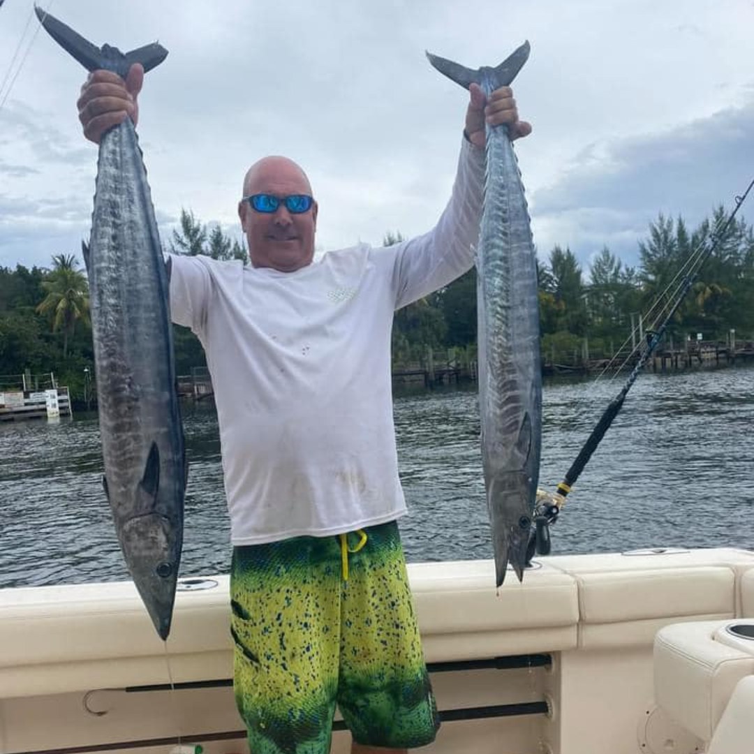 Fisherman with 2 big fish in Pompano Beach