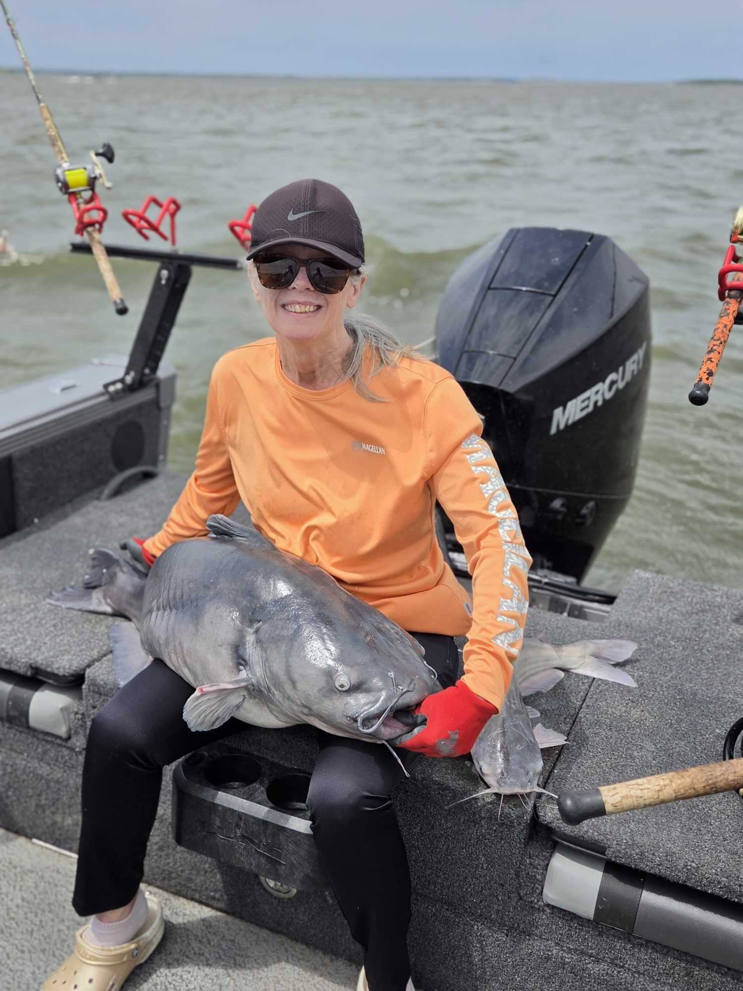 Large catfish caught during fishing trip in Manhattan KS displayed on boat deck