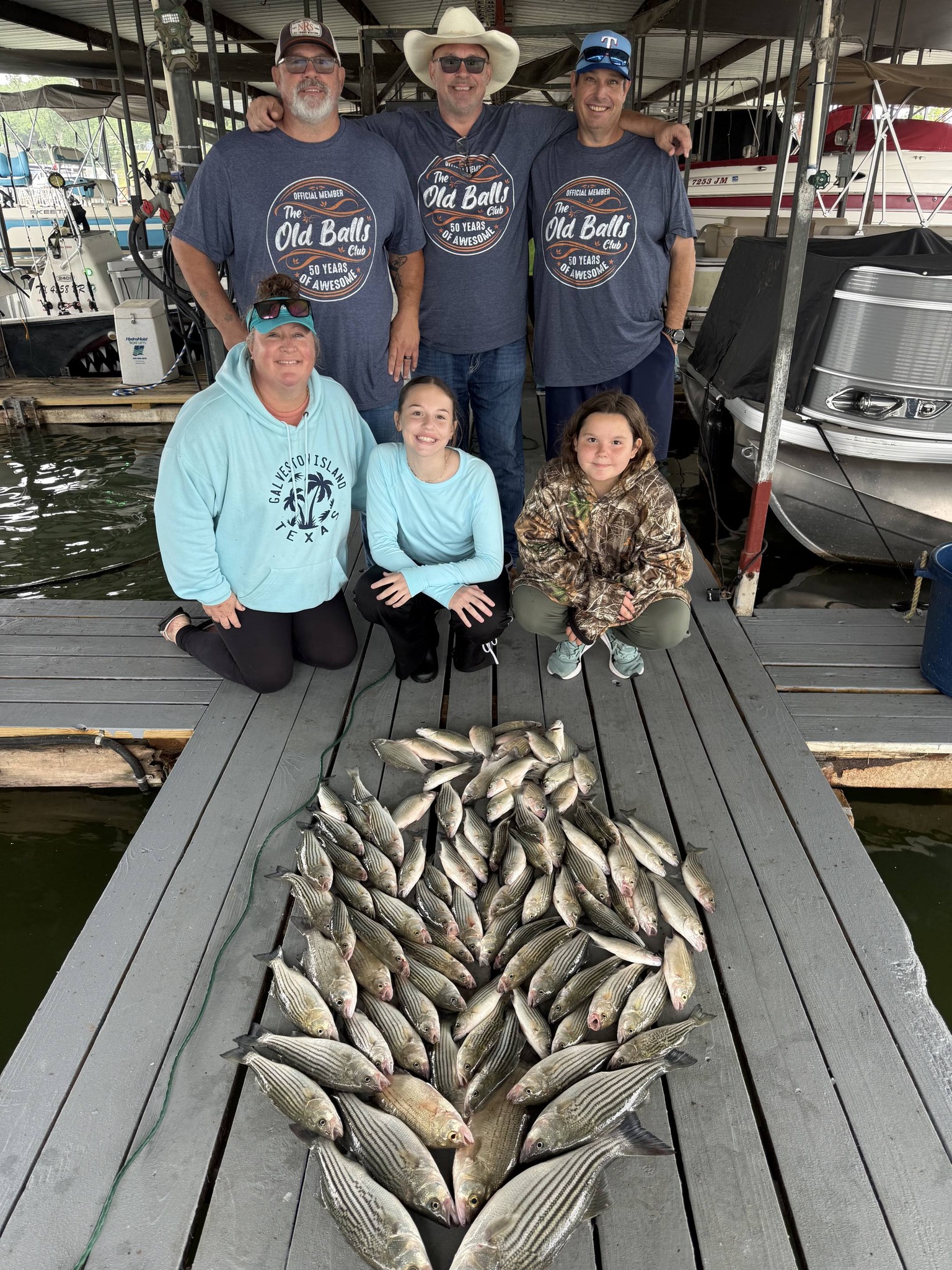 Large catch of striped bass displayed on fishing dock in Pottsboro TX