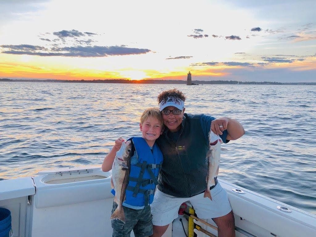 Two anglers posing with their catch in Newington