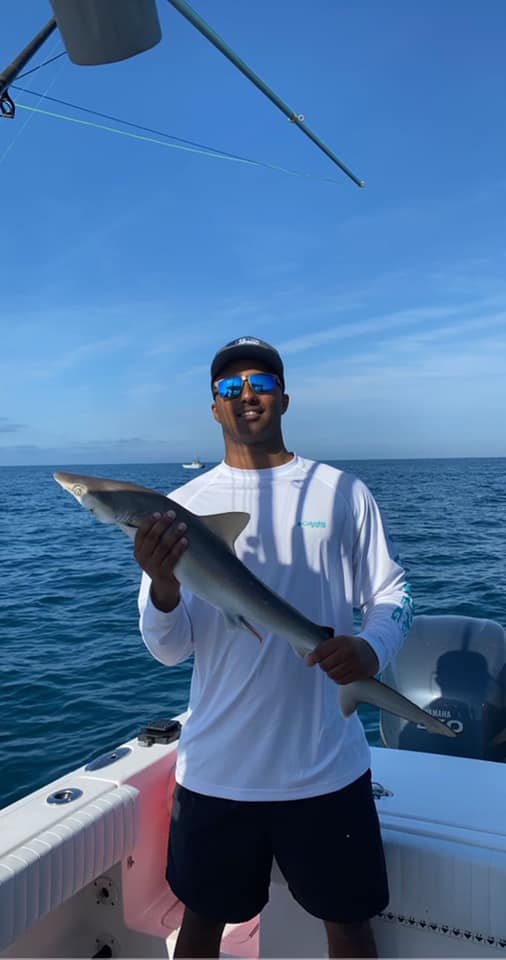 Angler holding a 19-inch fish in NC