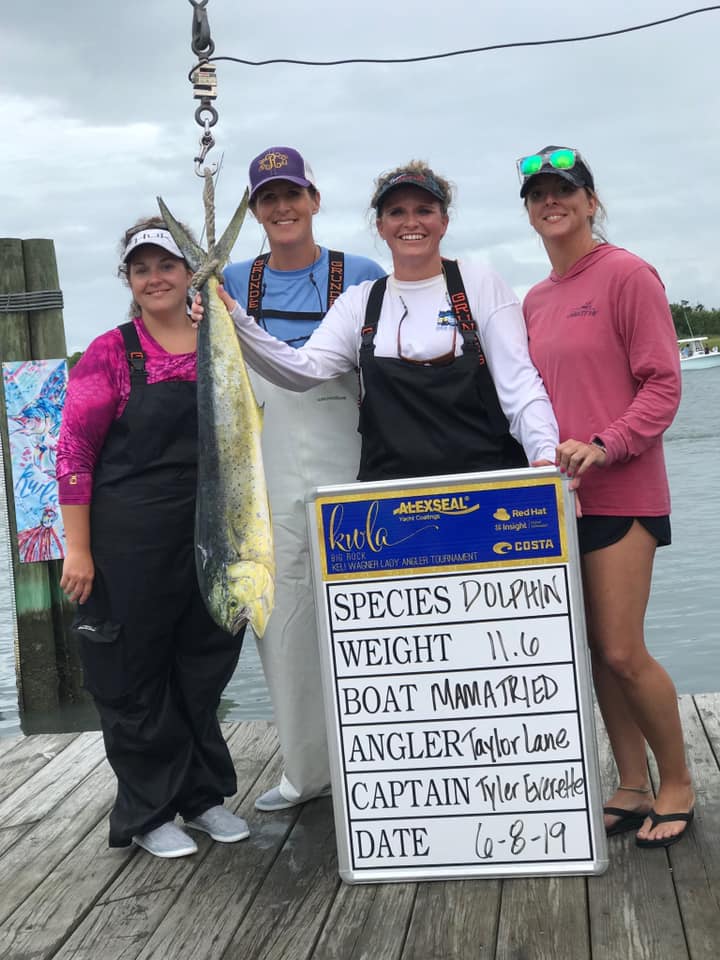 4 people stand in NC with a large 26 inch fish