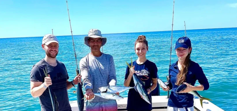 Four people enjoying the fishing experience in Rincón