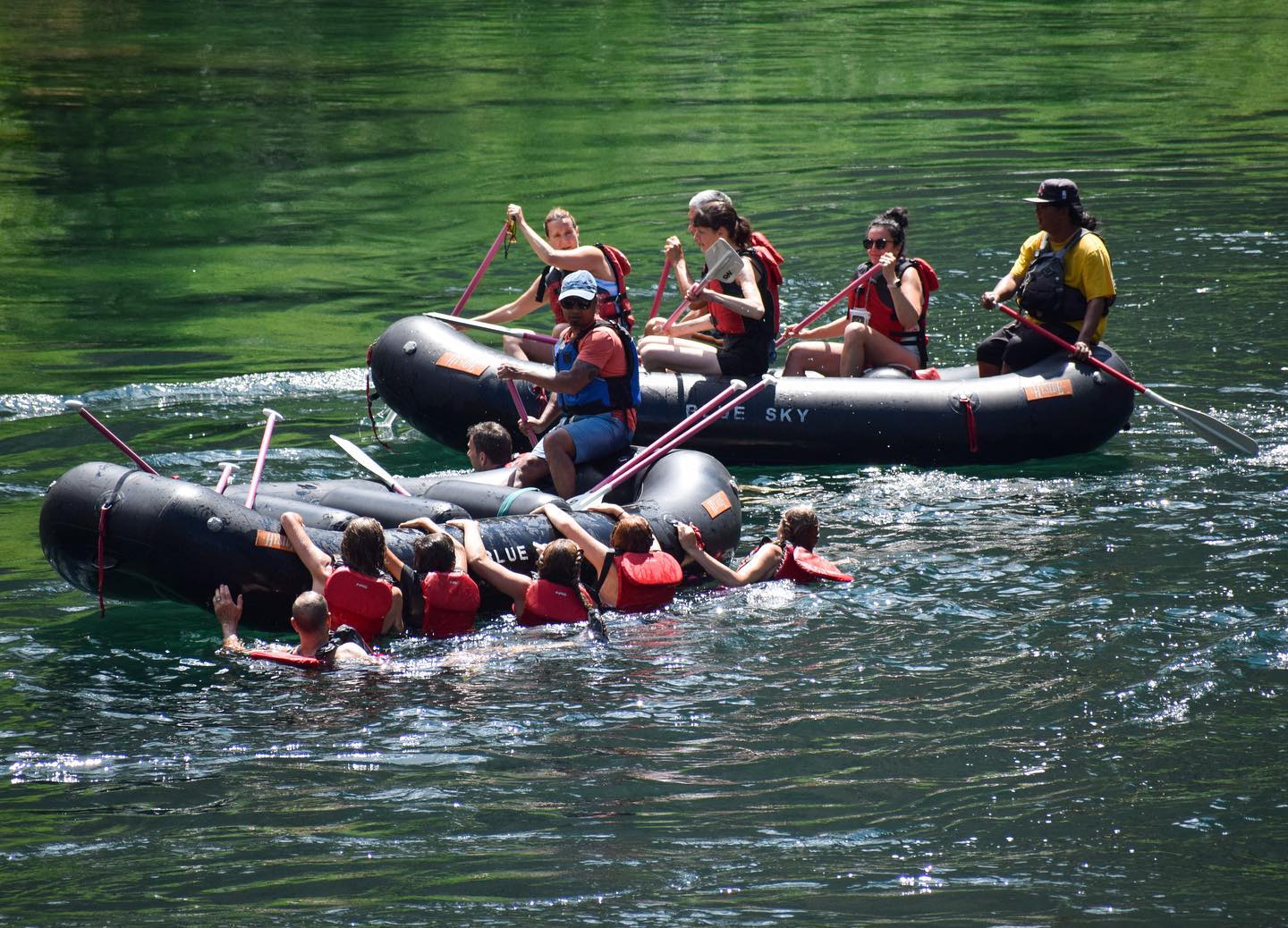 Rafting group paddling through rapids on Upper Clackamas River with professional guide
