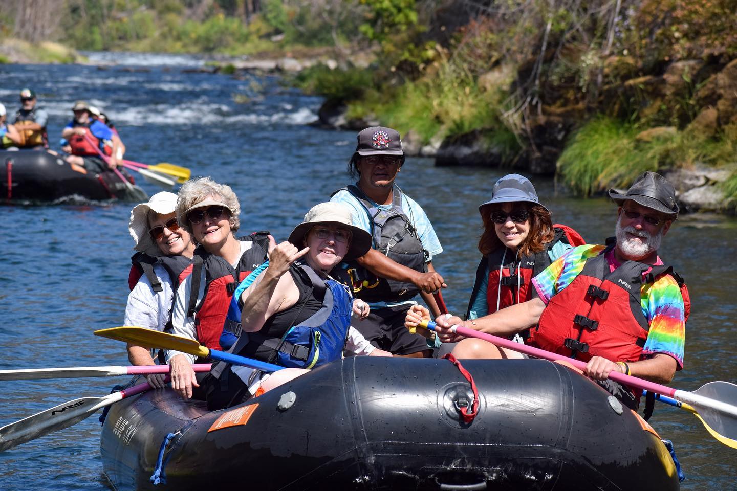 NRS raft navigating Upper Clackamas River rapids with guide and guests during Oregon rafting trip