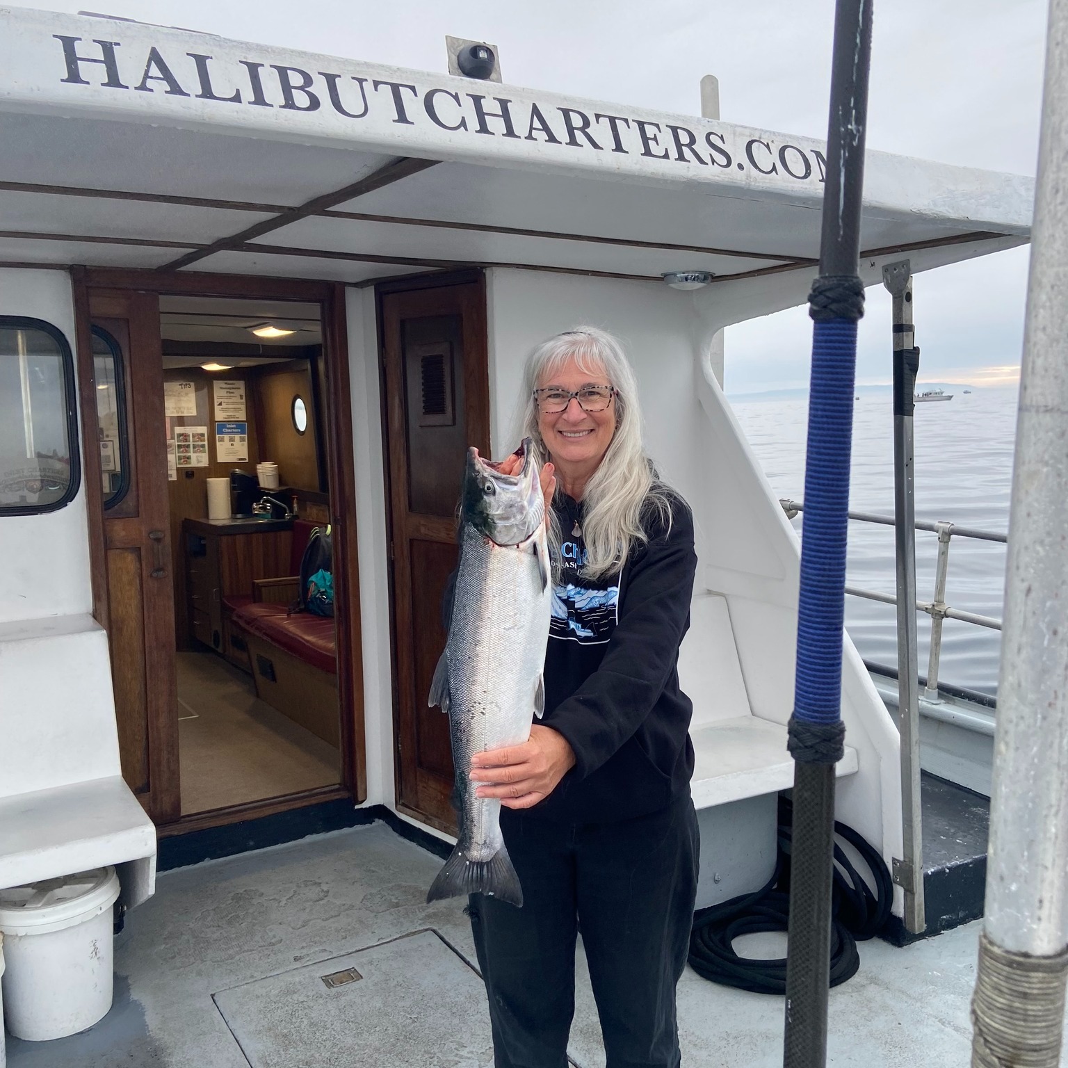 Coho salmon caught in Alaska during a fishing cruise or tour